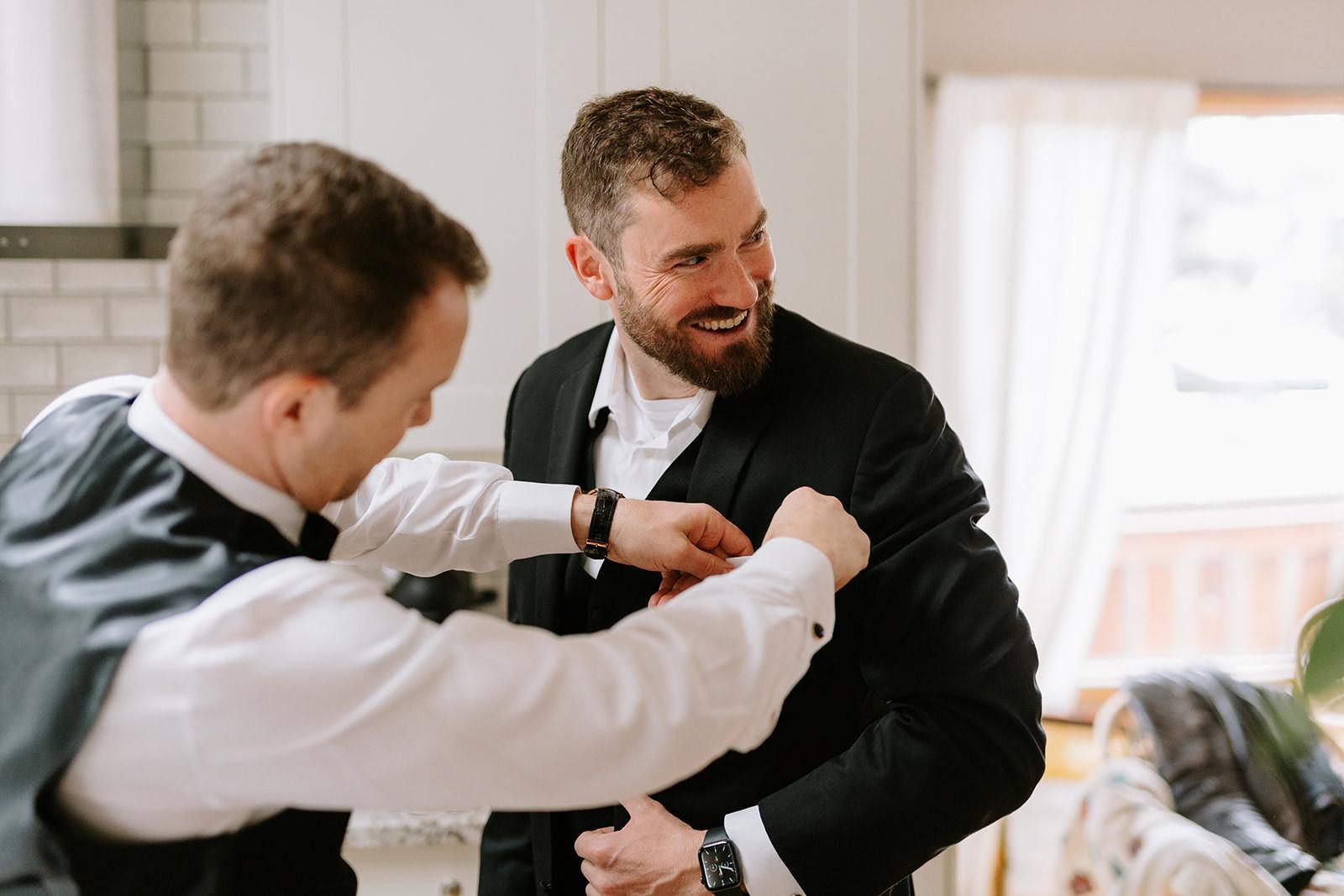 Groom and groomsmen getting ready for wedding in the morning