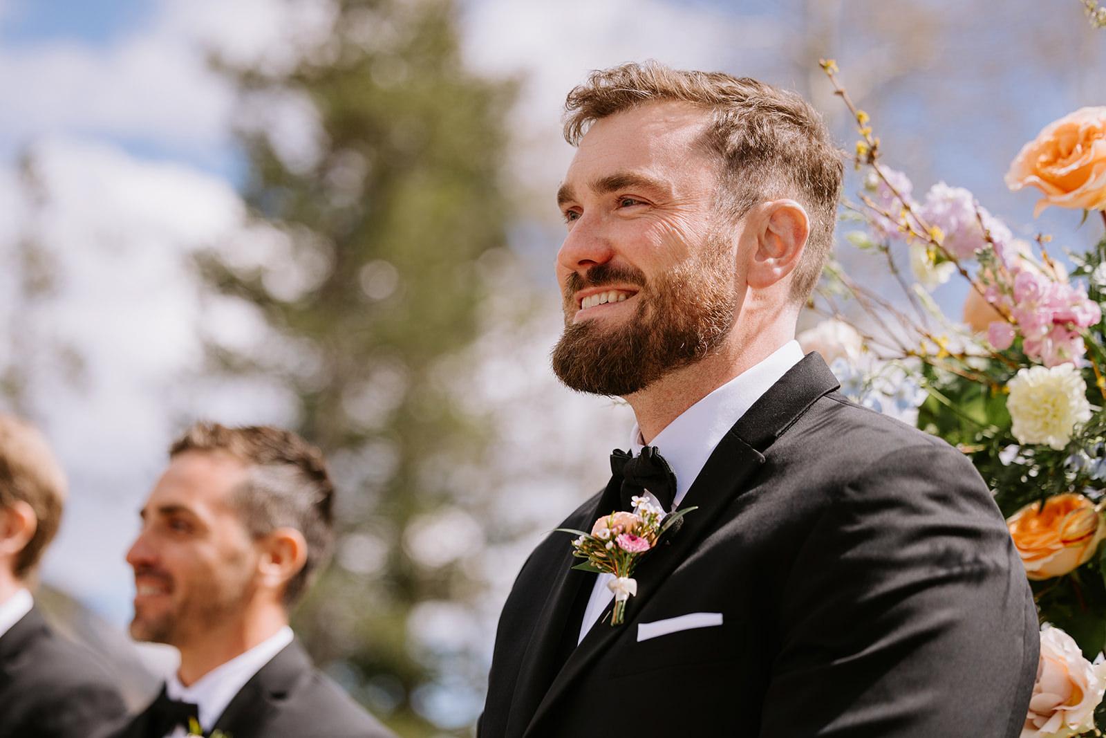 Groom reacts as bride walks down aisle at Silvertip Resort