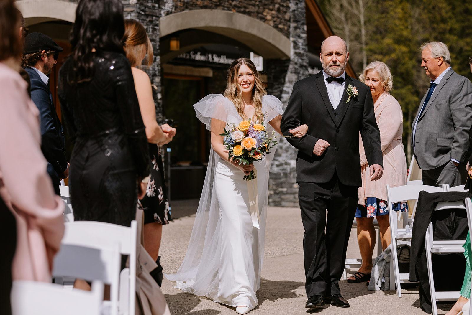 Bride walks down aisle at Silvertip Resort