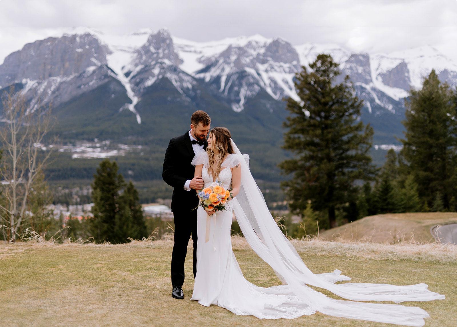Couple portrait in front of mountains at Silvertip