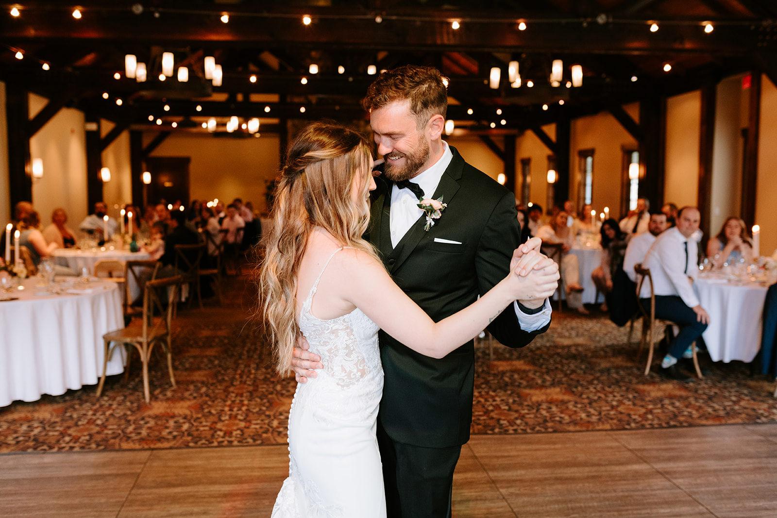 Couples first dance at their rustic mountain wedding at Silvertip Pavilion