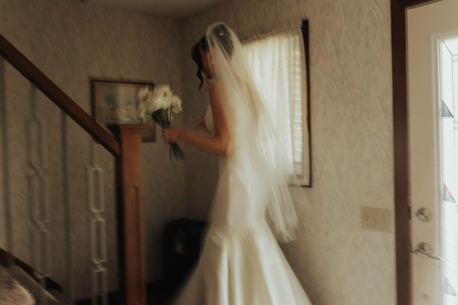 Cinematic portrait of a bride walking away, motion blur