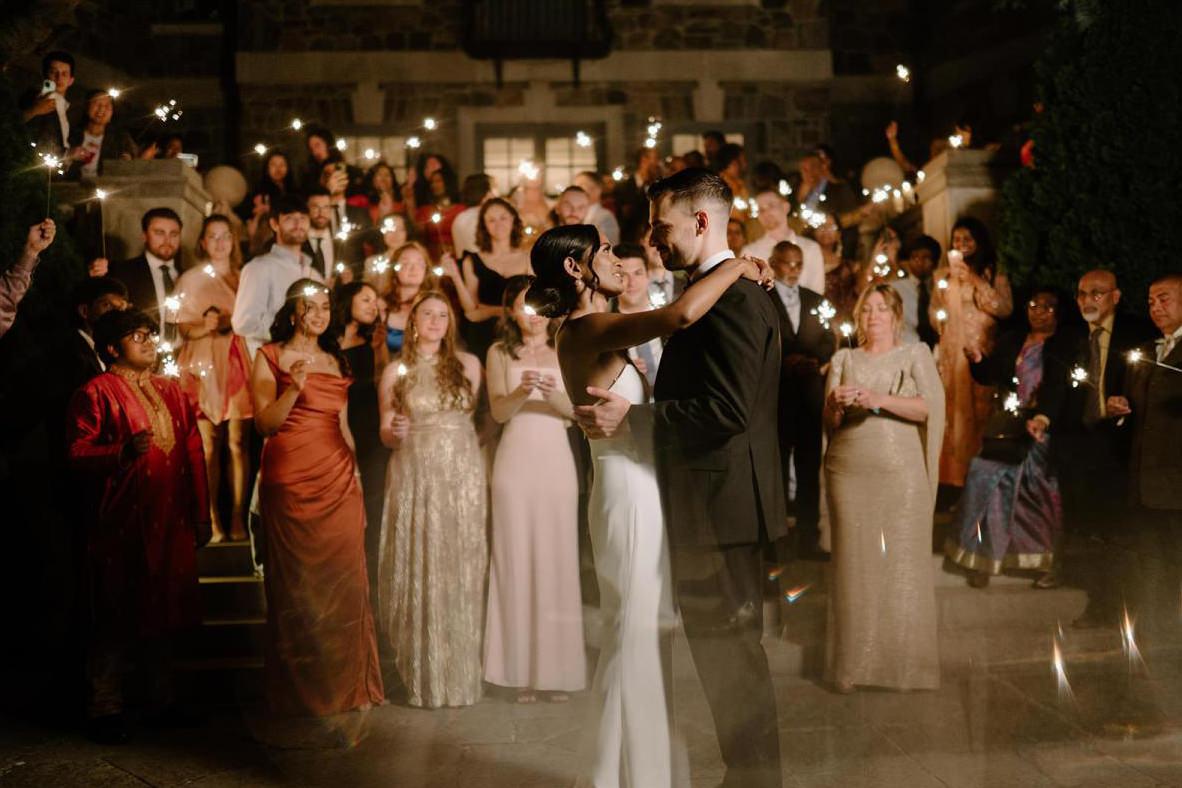 Couple having their first dance surrounded by guests holding sparklers, windsor, Ontario