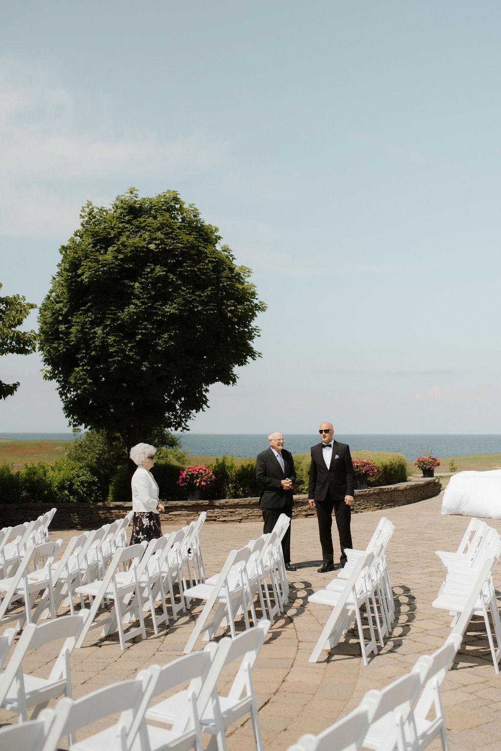 Guests gather before wedding ceremony, Fox Harb'r resort, Nova Scotia