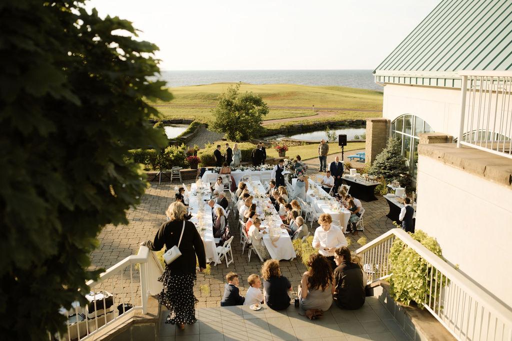 Outdoor dinner wedding reception at Fox Harb'r resort, Nova Scotia