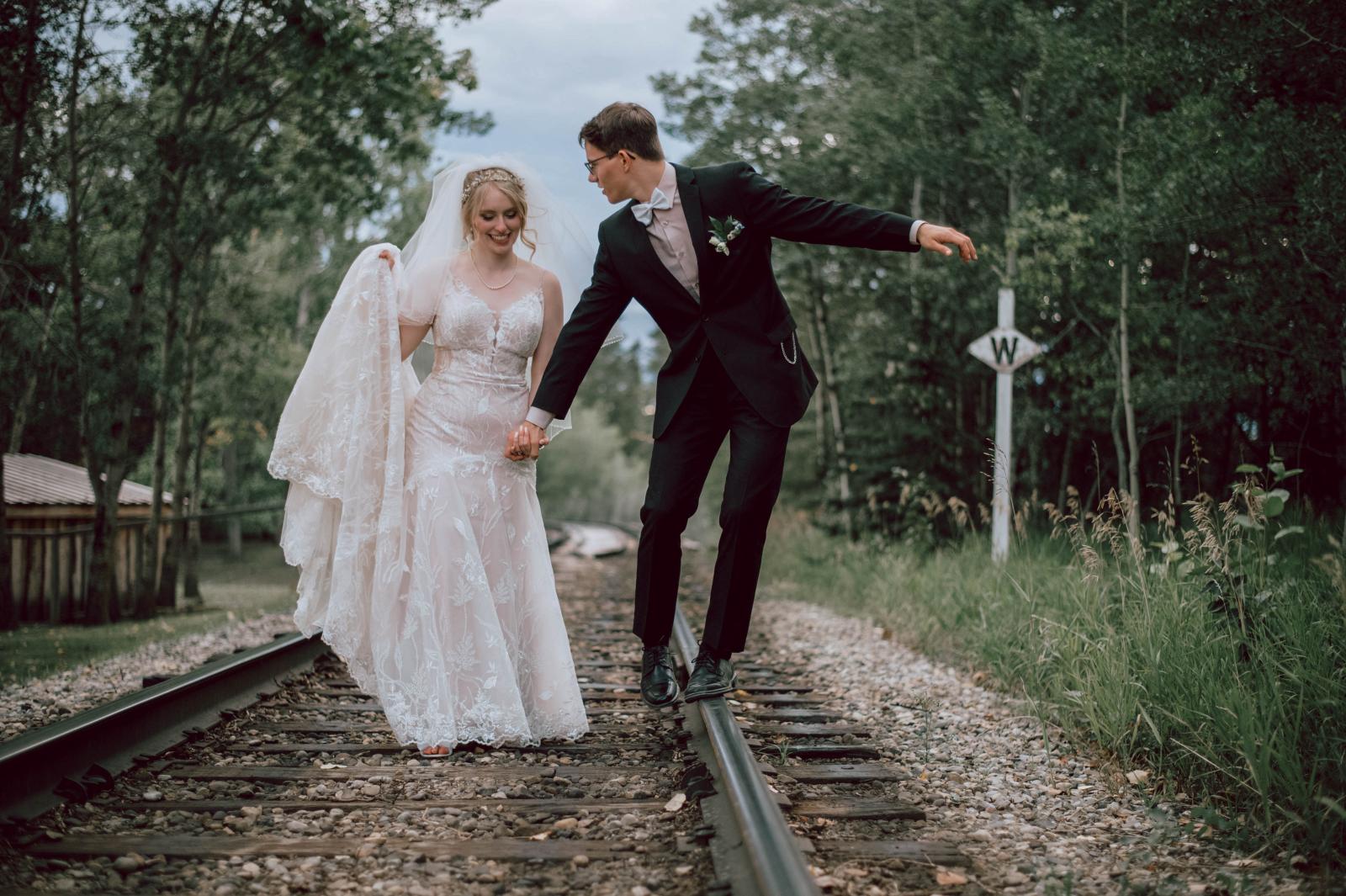 Couple on train tracks heritage park, calgary