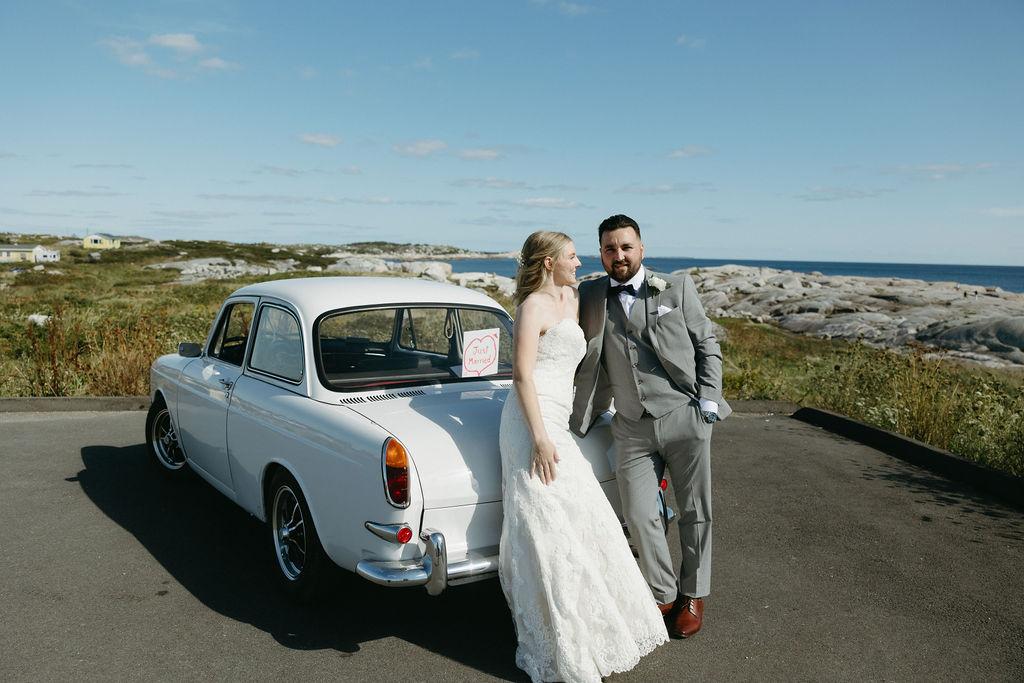Bride and groom with classic car at their Oceanstone resort wedding