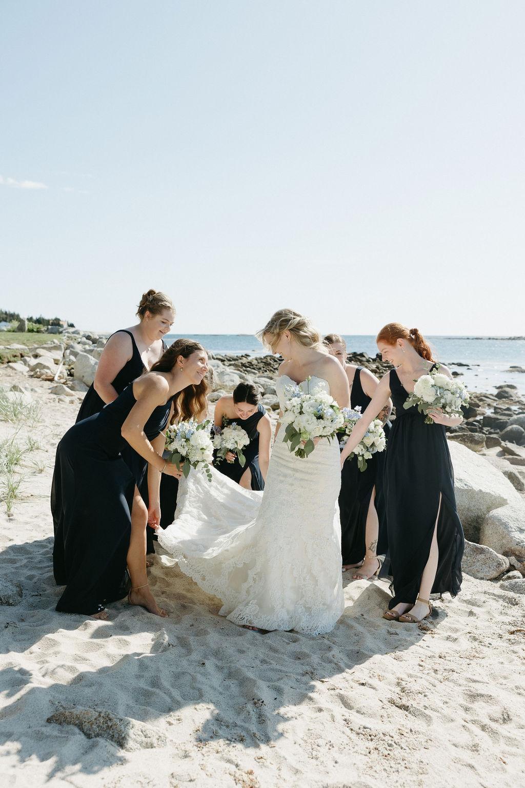Bride with bridesmaids on the beach at Oceanstone resort