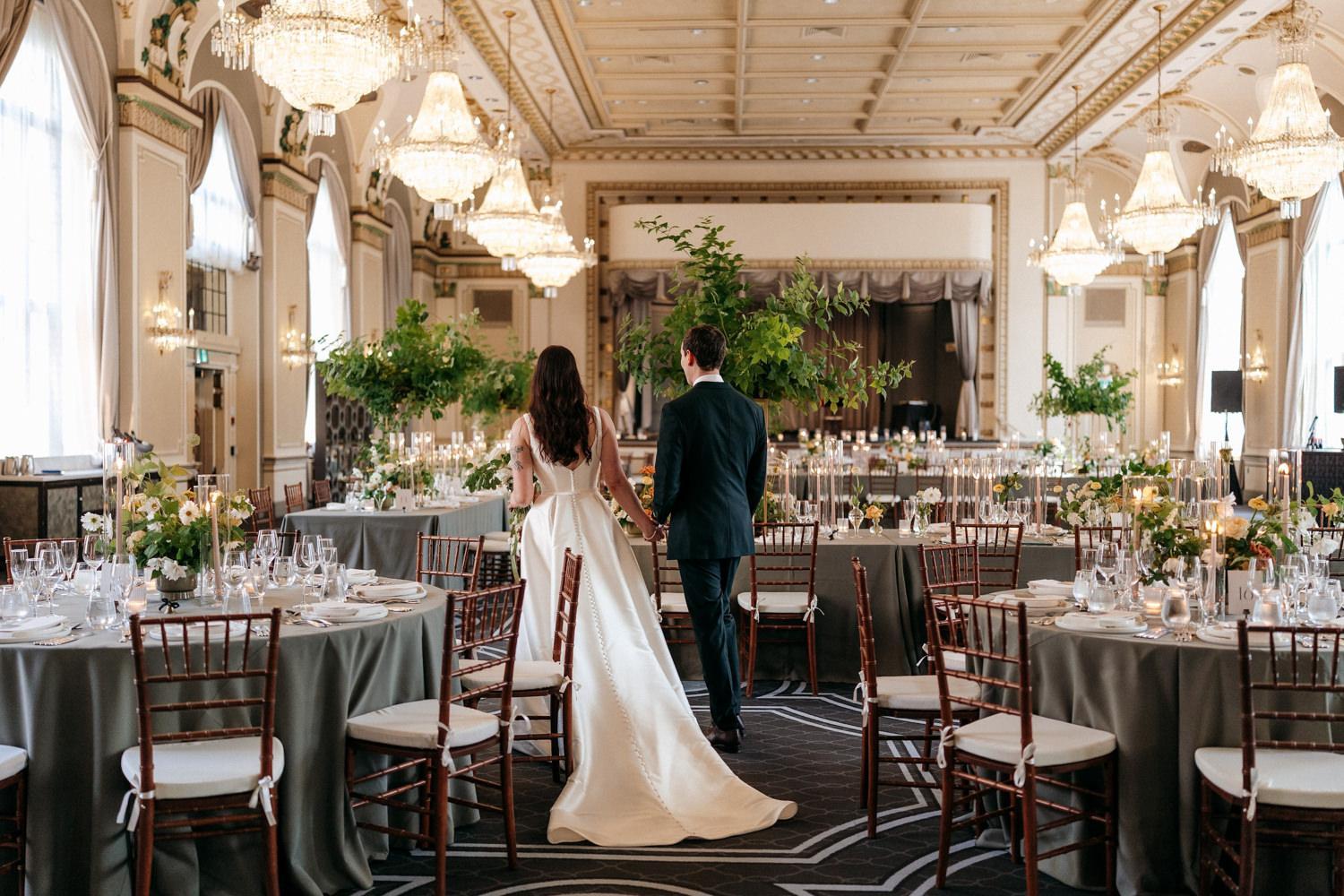 Bride and Groom walking into their elegant reception venue, montreal
