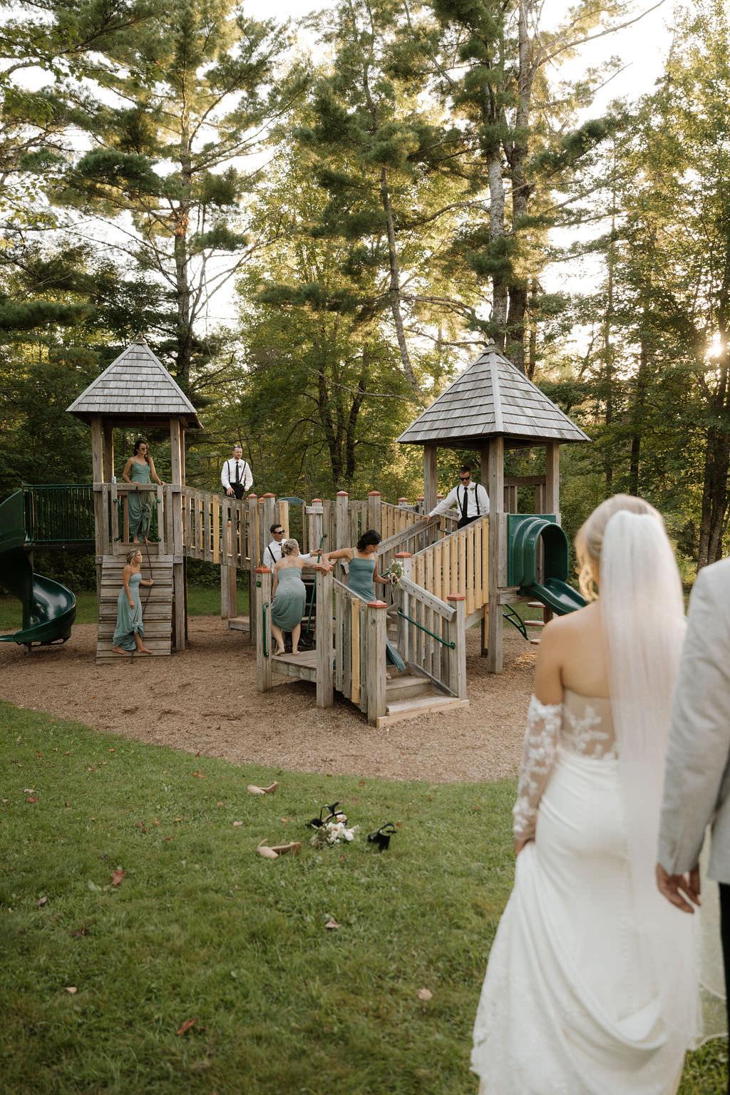 Wedding party playing on play structure
