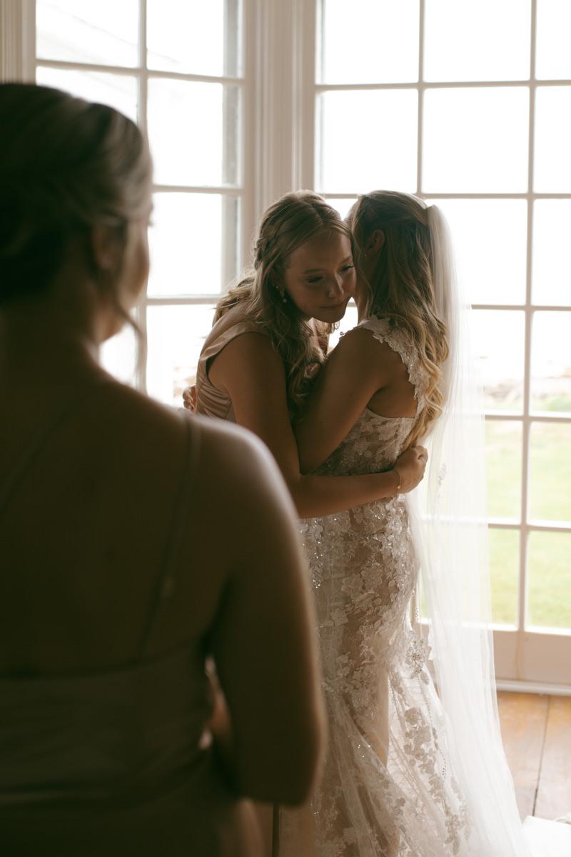 Bridal getting ready on the morning of her wedding at Thinkers Lodge, wedding dress
