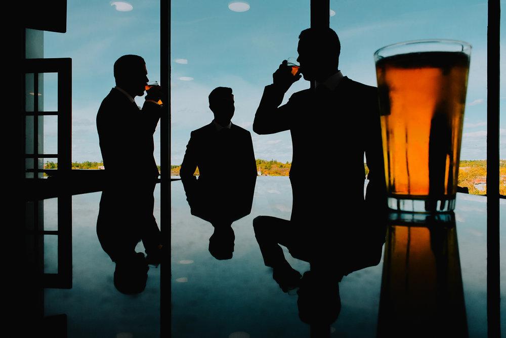 Silhouette of groomsment at Clarion Lakeside Hotel Wedding, Black & Gold Photography
