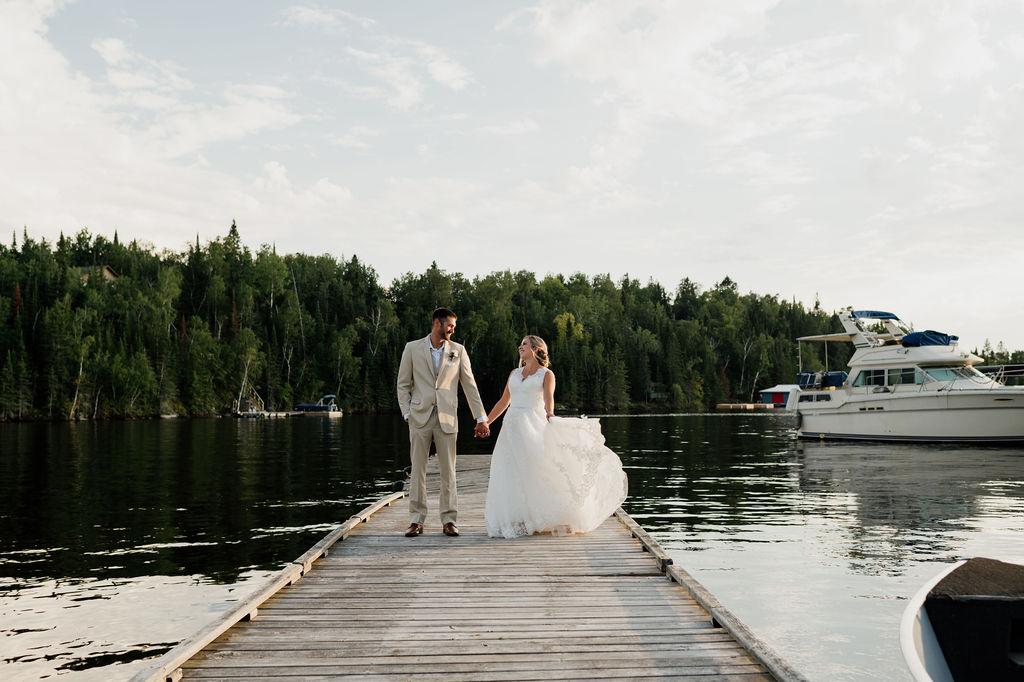 Bride and groom on dock at Kenora Golf & Country Club, Amanda Longe