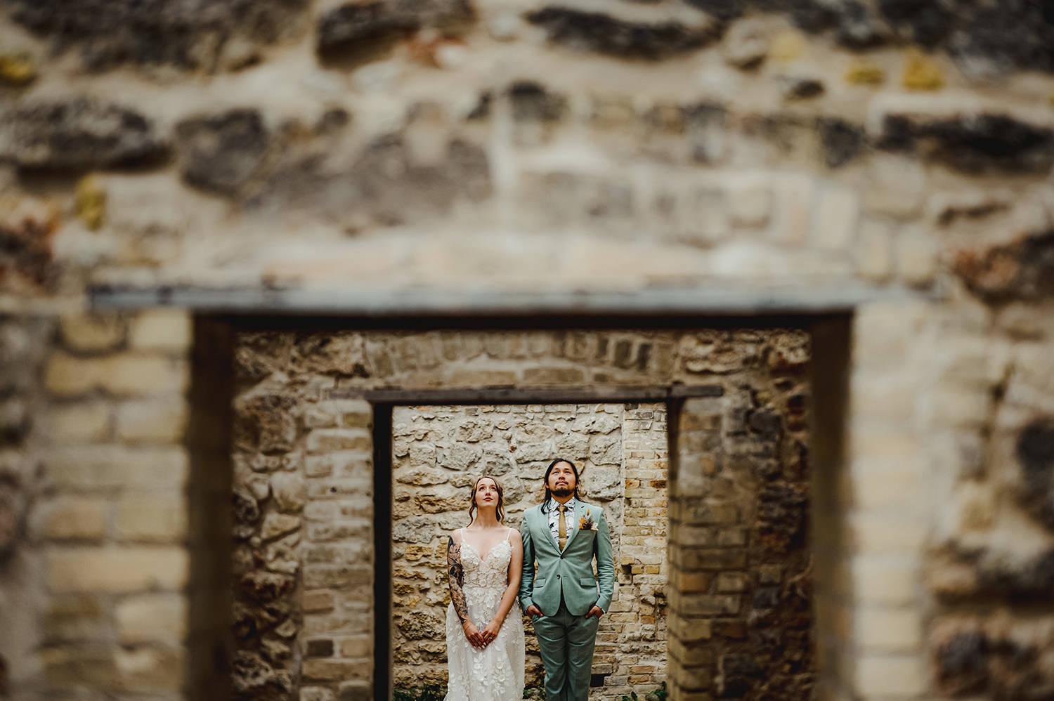 Stylish couple in a creative wedding photo at the Trappist Monastery in St. Norbert, Manitoba